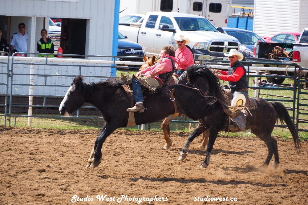 Bareback student sticks tight on one of Francis Rodeo's broncs.
